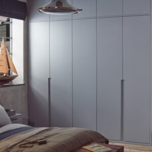 Sculpt bedroom door design with sleek handleless cabinetry and minimalist styling